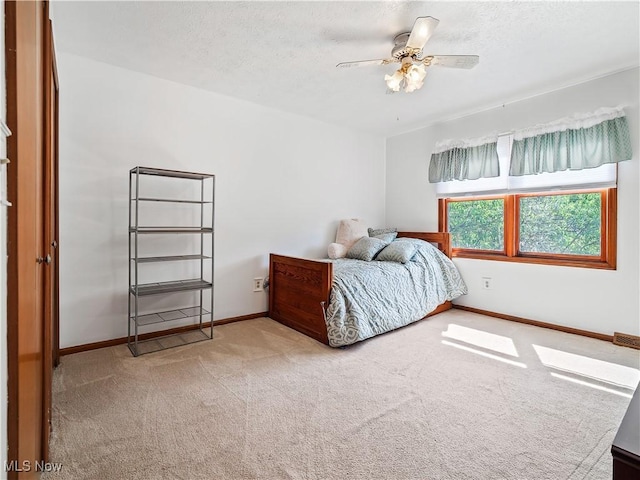 21428 Montclare Blvd, Strongsville, OH 44149 - carpeted bedroom with baseboards, ceiling fan, and a textured ceiling