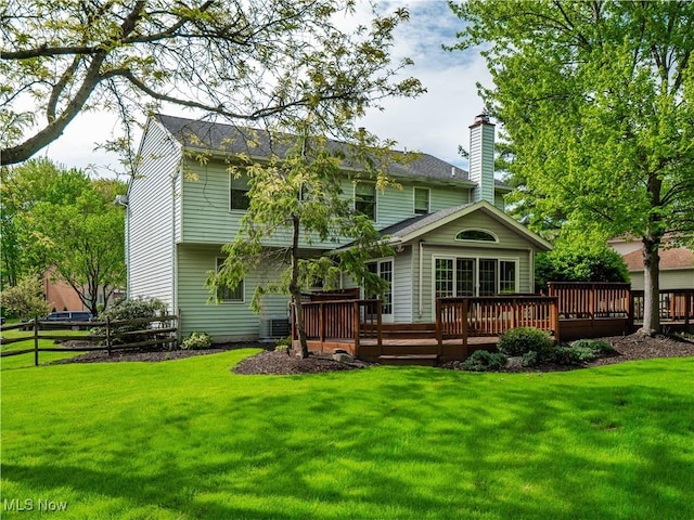 21428 Montclare Blvd, Strongsville, OH 44149 - rear view of house with a wooden deck and a chimney
