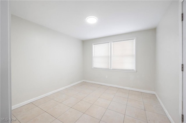 2400 Saybrook Rd, University Heights, OH 44118 - spare room with light tile patterned floors and baseboards