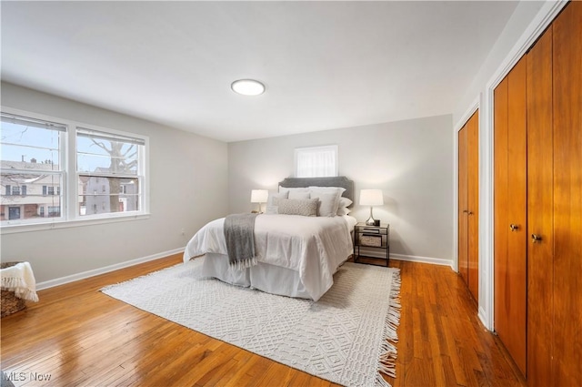 2400 Saybrook Rd, University Heights, OH 44118 - bedroom with a closet, baseboards, and wood finished floors