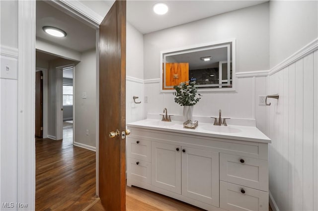 2400 Saybrook Rd, University Heights, OH 44118 - bathroom with double vanity, wood finished floors, and wainscoting