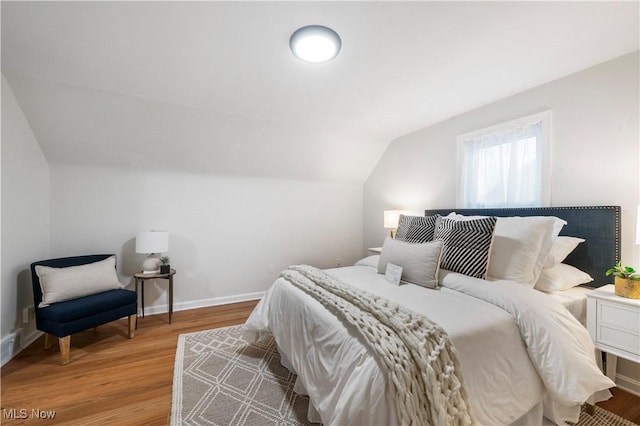 2400 Saybrook Rd, University Heights, OH 44118 - bedroom with vaulted ceiling, wood finished floors, and baseboards