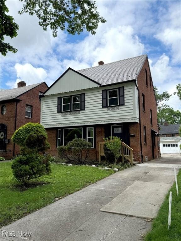 2400 Saybrook Rd, University Heights, OH 44118 - view of front facade with brick siding and a front yard