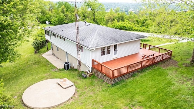 1655 Calder Ridge Rd, Belpre, OH 45714 - rear view of house with a wooden deck, roof with shingles, central AC unit, a lawn, and a view of trees