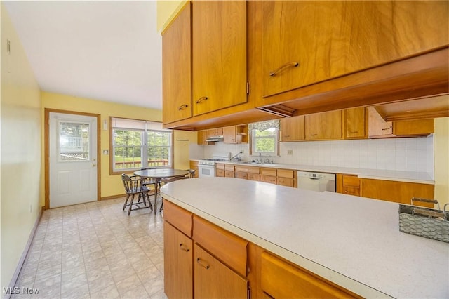 1655 Calder Ridge Rd, Belpre, OH 45714 - kitchen featuring baseboards, white appliances, light countertops, and healthy amount of natural light