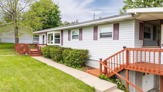 1655 Calder Ridge Rd, Belpre, OH 45714 - view of side of home with a yard and a wooden deck