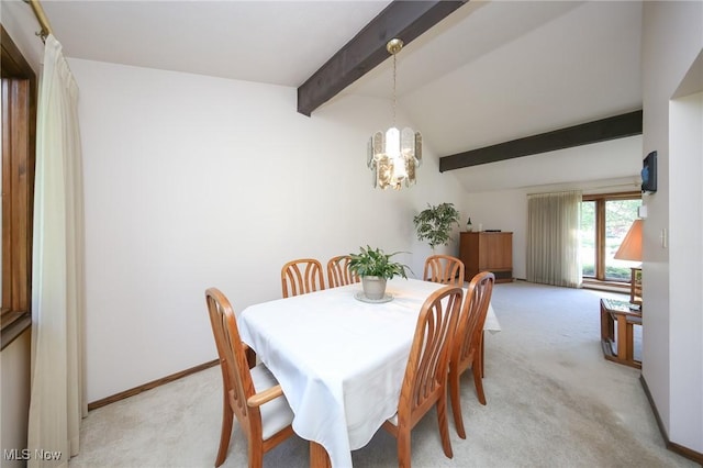 dining room with light colored carpet, a chandelier, and baseboards