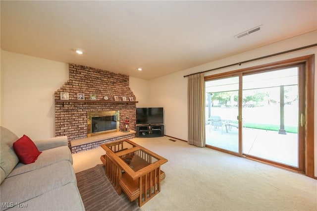 living room featuring carpet flooring and a brick fireplace