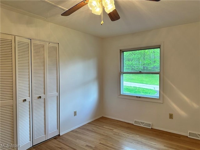 9744 Andrea Dr, Concord, OH 44060 - unfurnished bedroom featuring light wood-style flooring, a closet, baseboards, and a ceiling fan