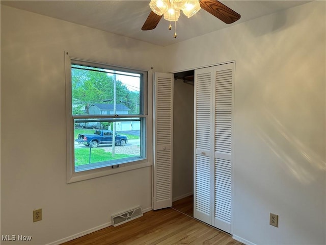 9744 Andrea Dr, Concord, OH 44060 - unfurnished bedroom with light wood-style floors, baseboards, a closet, and ceiling fan