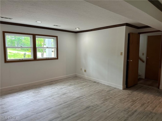 9744 Andrea Dr, Concord, OH 44060 - spare room featuring ornamental molding, wood finished floors, a textured ceiling, baseboards, and recessed lighting