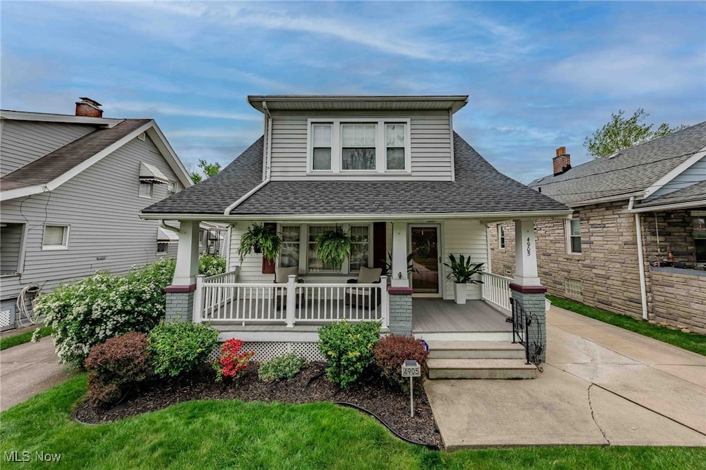 4905 Wetzel Ave, Cleveland, OH 44109 - bungalow featuring covered porch and roof with shingles