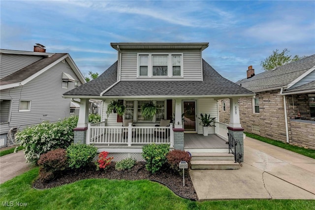4905 Wetzel Ave, Cleveland, OH 44109 - bungalow featuring covered porch and roof with shingles