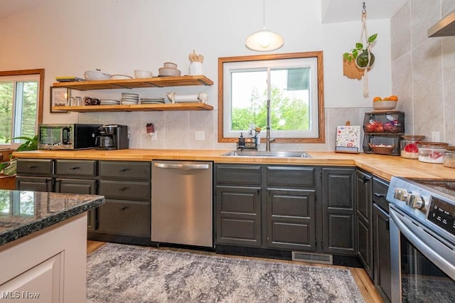 8584 Fisher Rd, Diamond, OH 44412 - kitchen featuring stainless steel appliances, wooden counters, healthy amount of natural light, and open shelves