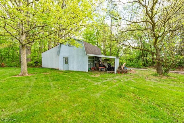 8584 Fisher Rd, Diamond, OH 44412 - view of grassy yard with an outbuilding, an outdoor structure, and a carport