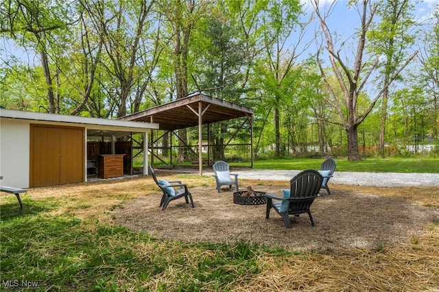 17469 Laurel Ave, Lake Milton, OH 44429 - view of green lawn featuring a fire pit and an outdoor structure