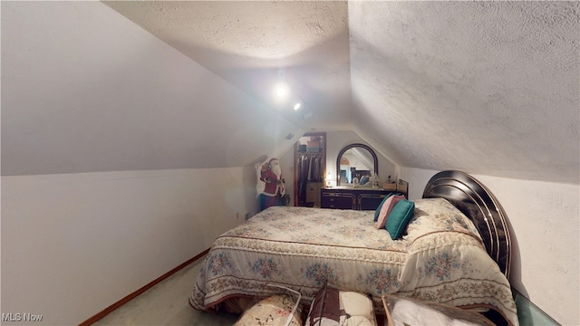 carpeted bedroom with a textured ceiling, lofted ceiling, and baseboards