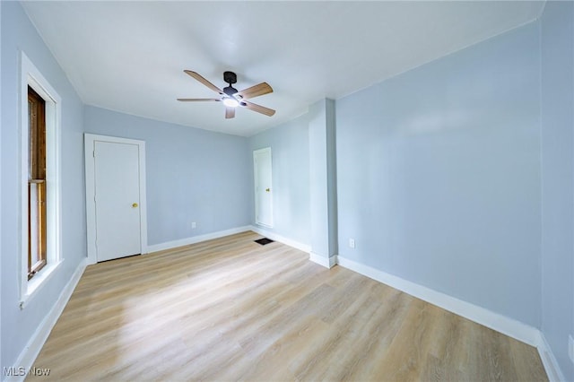 9324 Columbia Rd, Olmsted Falls, OH 44138 - empty room with light wood-type flooring, a ceiling fan, and baseboards