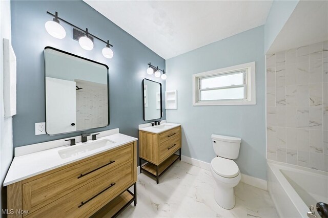 9324 Columbia Rd, Olmsted Falls, OH 44138 - full bath featuring marble finish flooring, baseboards, toilet, and two vanities