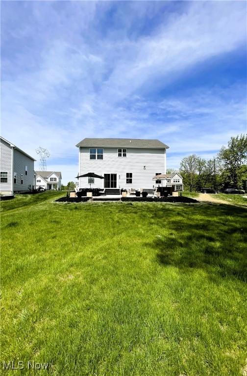 1810 Muirfield Ln, Painesville, OH 44077 - rear view of house with a yard