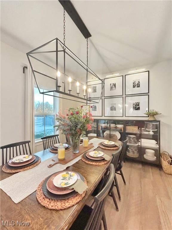 1810 Muirfield Ln, Painesville, OH 44077 - dining space featuring a chandelier and wood finished floors