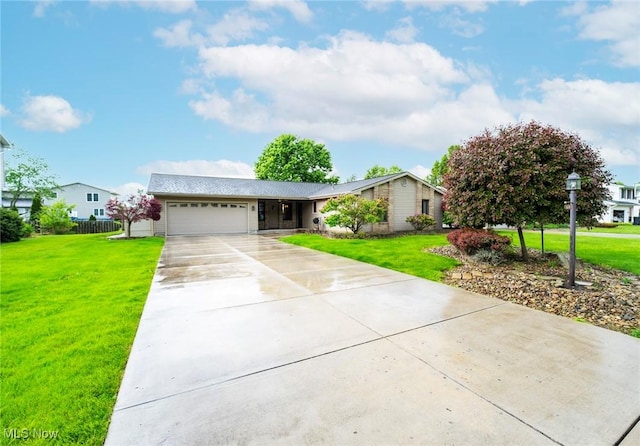 view of front of property featuring a garage and driveway
