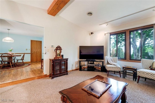 living area featuring carpet and baseboards