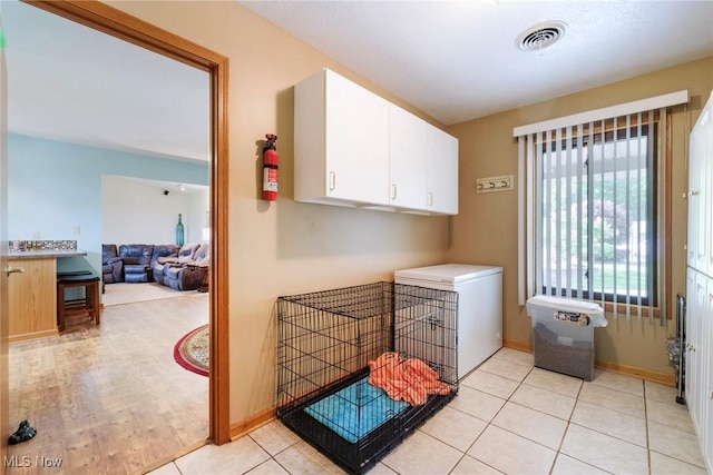 washroom featuring baseboards