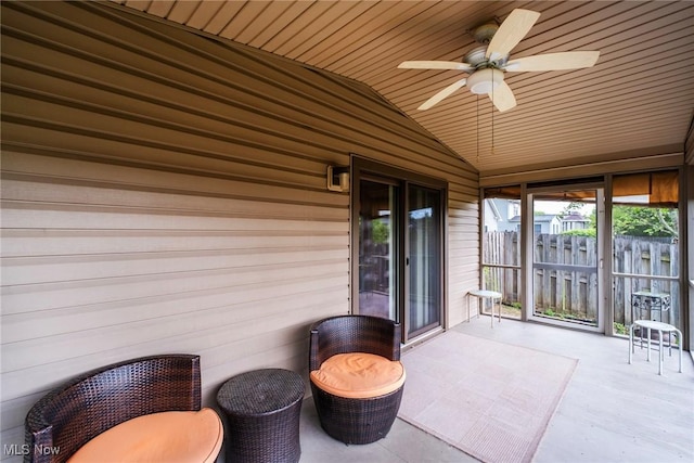 view of patio / terrace featuring a ceiling fan and fence