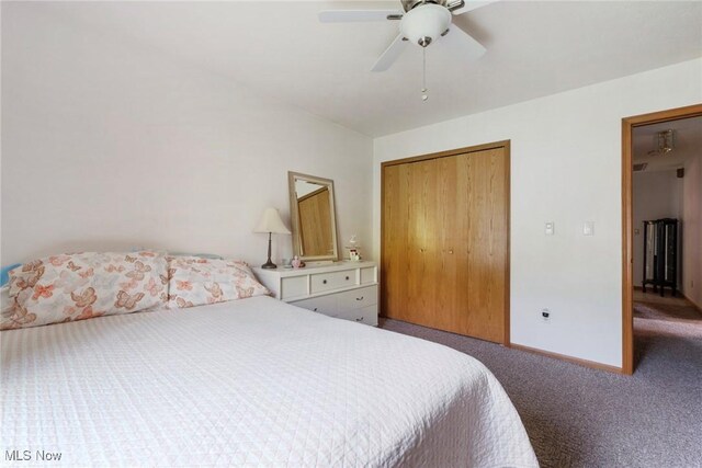 carpeted bedroom with a closet, a ceiling fan, and baseboards