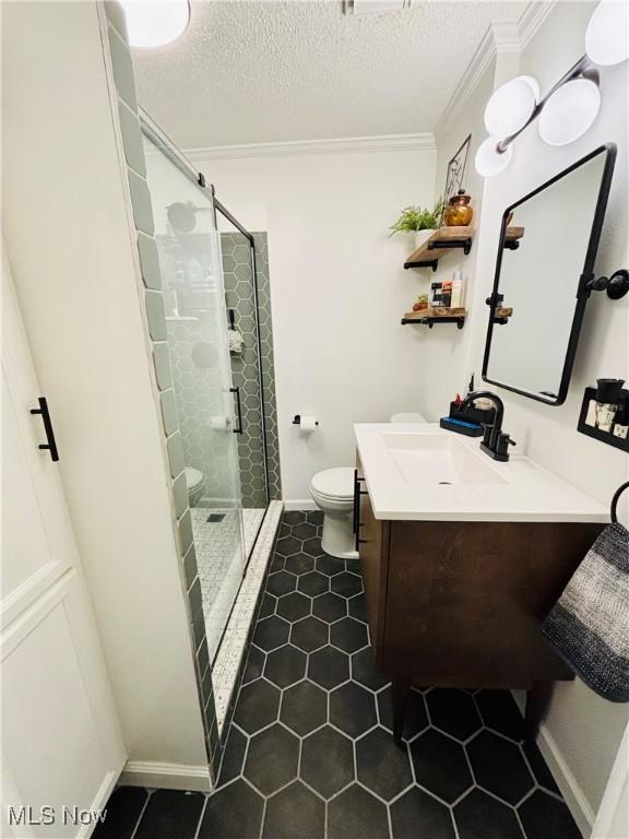 211 Kenwood St, Marietta, OH 45750 - full bath featuring toilet, crown molding, tile patterned flooring, vanity, and a shower stall