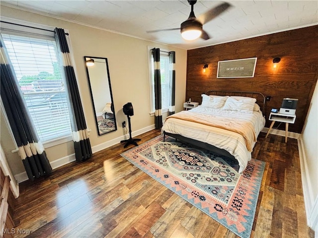 211 Kenwood St, Marietta, OH 45750 - bedroom with wood finished floors, baseboards, ceiling fan, wooden walls, and crown molding
