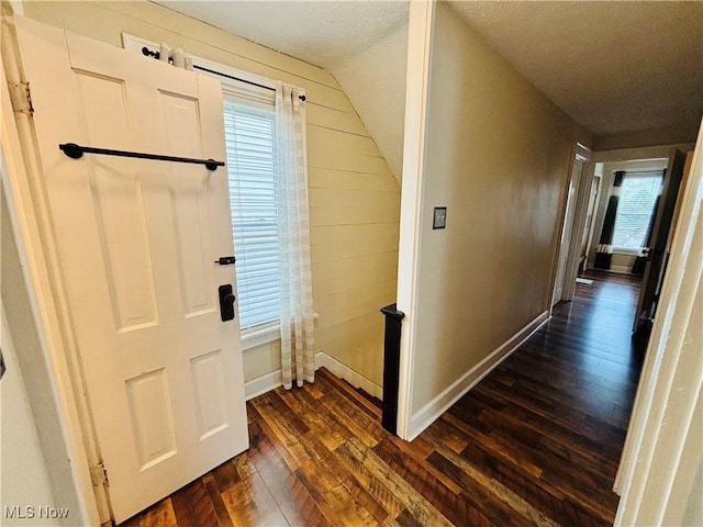 211 Kenwood St, Marietta, OH 45750 - foyer entrance with dark wood-style flooring, baseboards, and lofted ceiling