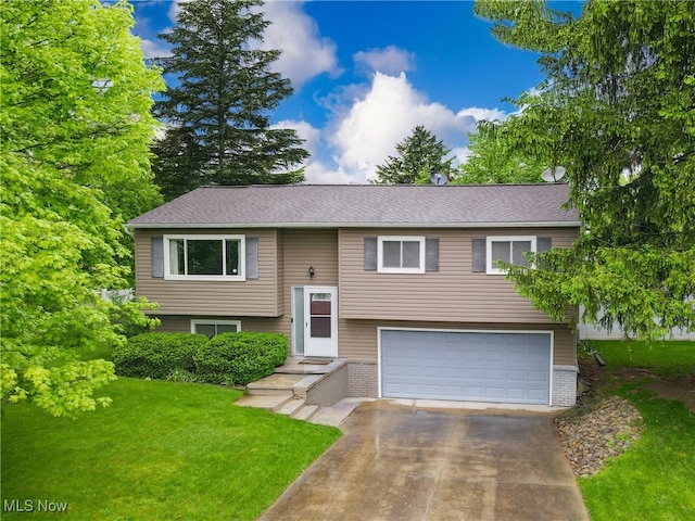 1395 Cecil Dr, Streetsboro, OH 44241 - raised ranch with a garage, a front lawn, driveway, and brick siding