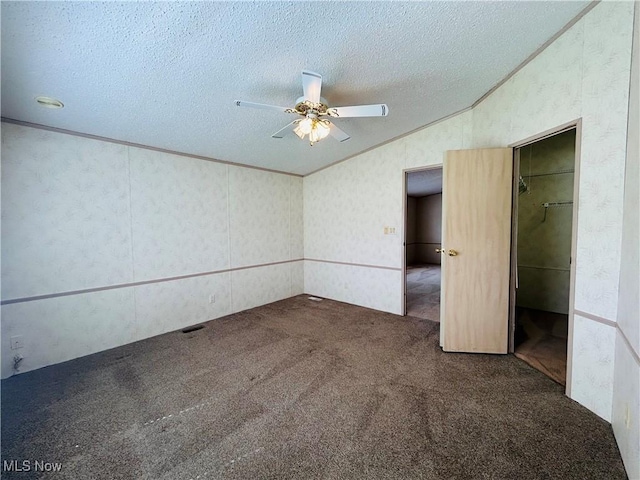 2270 S Commodore Ct, Lakeside-Marblehead, OH 43440 - unfurnished bedroom featuring vaulted ceiling, carpet flooring, a textured ceiling, and ceiling fan