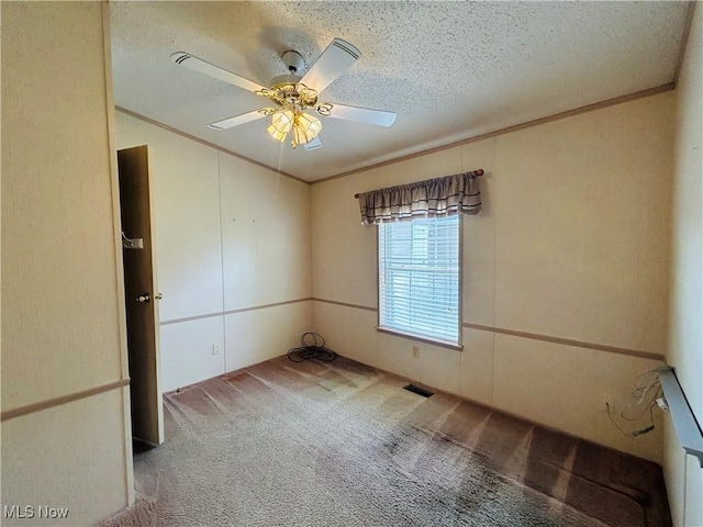 2270 S Commodore Ct, Lakeside-Marblehead, OH 43440 - unfurnished room featuring carpet floors, crown molding, a textured ceiling, and ceiling fan
