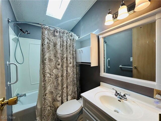 2270 S Commodore Ct, Lakeside-Marblehead, OH 43440 - bathroom with toilet, shower / tub combo with curtain, vanity, and a textured ceiling