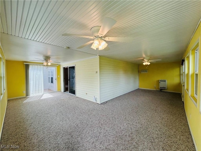 2270 S Commodore Ct, Lakeside-Marblehead, OH 43440 - carpeted spare room with plenty of natural light, a ceiling fan, heating unit, and wooden walls
