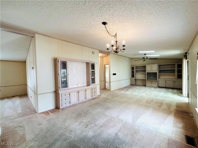 2270 S Commodore Ct, Lakeside-Marblehead, OH 43440 - unfurnished living room with a chandelier, carpet, ceiling fan, and a textured ceiling