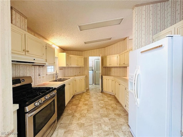 2270 S Commodore Ct, Lakeside-Marblehead, OH 43440 - kitchen with stainless steel range with gas stovetop, white refrigerator with ice dispenser, wallpapered walls, a sink, and under cabinet range hood