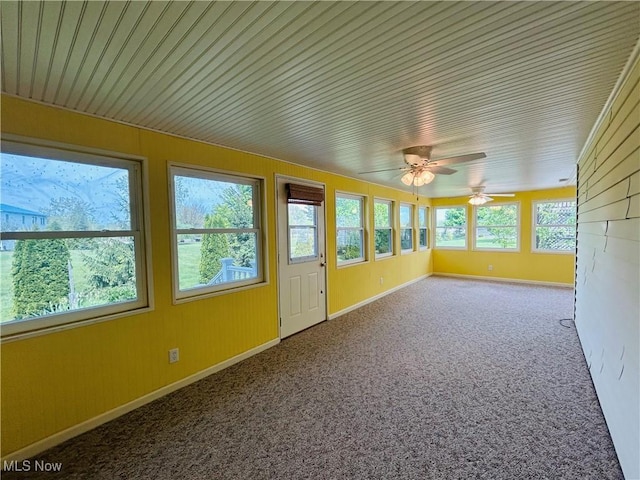 2270 S Commodore Ct, Lakeside-Marblehead, OH 43440 - unfurnished sunroom featuring plenty of natural light, carpet flooring, wooden ceiling, baseboards, and wood walls