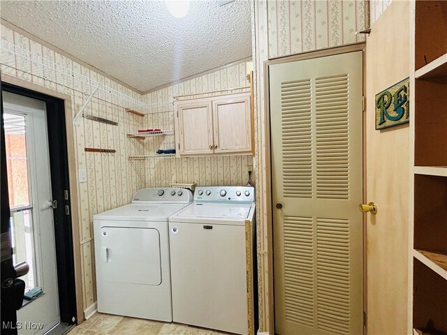 2270 S Commodore Ct, Lakeside-Marblehead, OH 43440 - washroom featuring wallpapered walls, washing machine and dryer, cabinet space, a textured ceiling, and baseboards