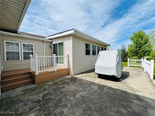 2270 S Commodore Ct, Lakeside-Marblehead, OH 43440 - view of property exterior featuring fence, a patio area, and a deck