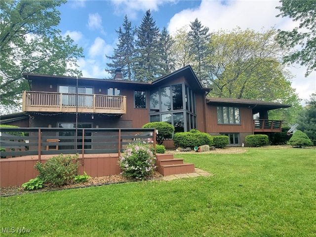 9651 Skyway Dr, Wadsworth, OH 44281 - back of property with a balcony, a yard, and a chimney