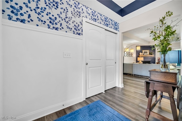 entrance foyer with wood finished floors and baseboards