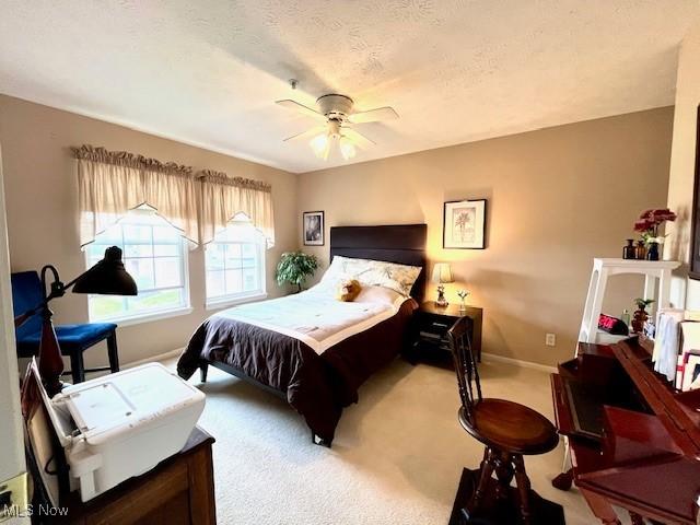 23003 Chandlers Ln Unit 219, Olmsted Falls, OH 44138 - carpeted bedroom with baseboards and a ceiling fan