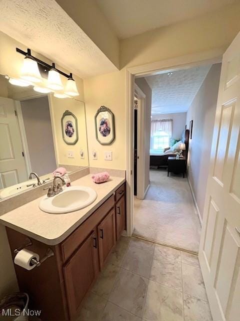 23003 Chandlers Ln Unit 219, Olmsted Falls, OH 44138 - bathroom with a textured ceiling and vanity