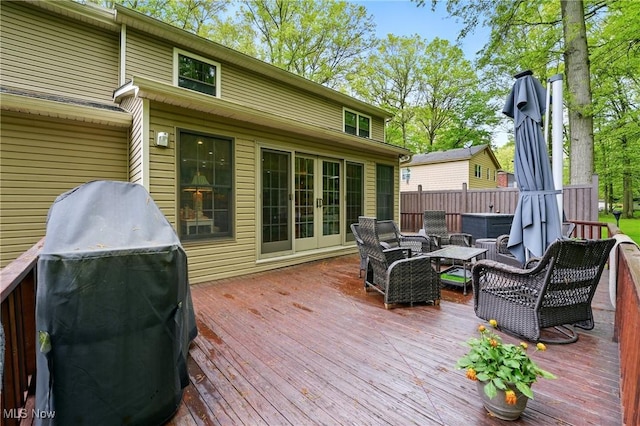 wooden terrace featuring area for grilling
