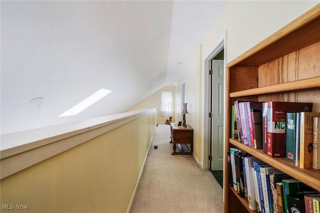 17466 Idylwild Ave, Lake Milton, OH 44429 - corridor with light colored carpet, a skylight, lofted ceiling, and baseboards