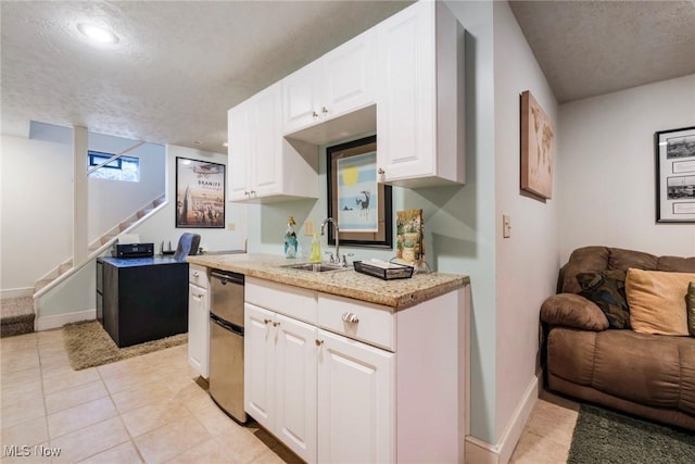 17466 Idylwild Ave, Lake Milton, OH 44429 - kitchen with a sink, open floor plan, white cabinets, baseboards, and a textured ceiling